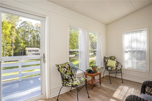 sunroom / solarium featuring lofted ceiling