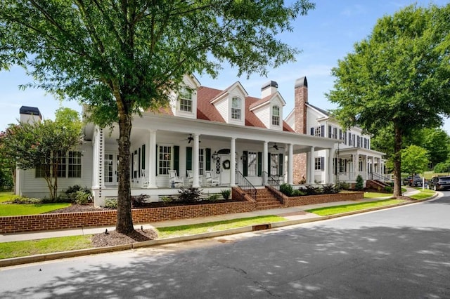 cape cod house featuring a porch