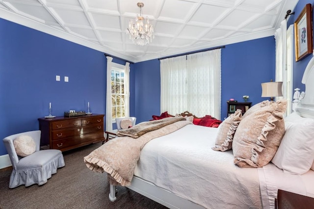 carpeted bedroom featuring a notable chandelier