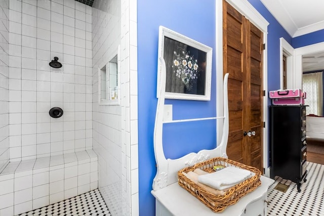 bathroom featuring vanity and a tile shower