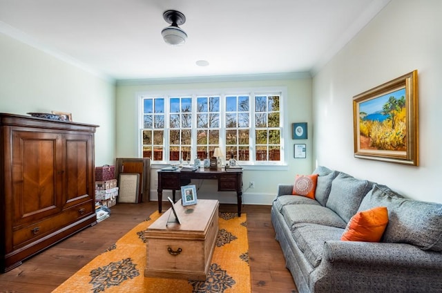 sitting room with ornamental molding and dark hardwood / wood-style floors