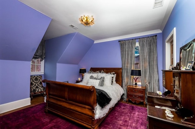 bedroom featuring carpet flooring and vaulted ceiling