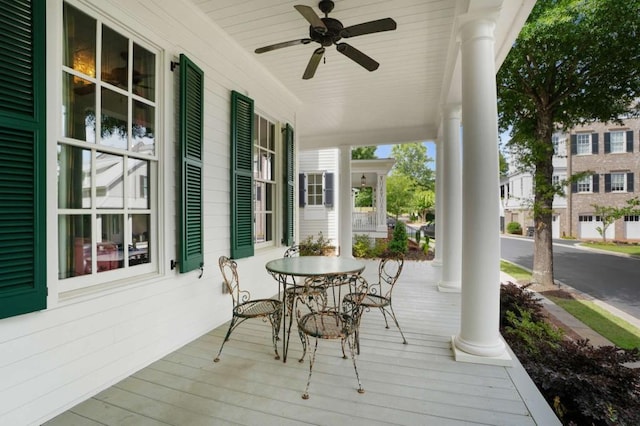 deck with ceiling fan and a porch