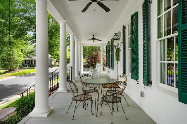 exterior space with ceiling fan and a porch