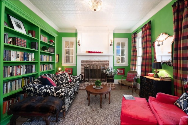 interior space with carpet flooring, ornamental molding, and a brick fireplace