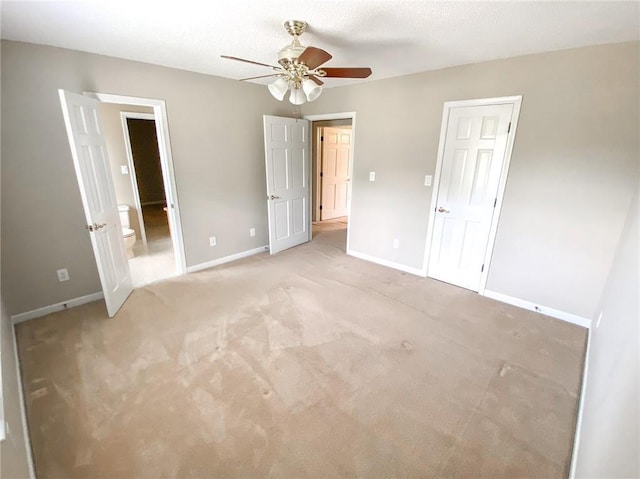 unfurnished bedroom with ceiling fan and light carpet