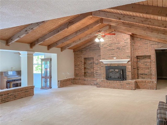 unfurnished living room featuring a wood stove, wooden ceiling, carpet flooring, ceiling fan, and brick wall