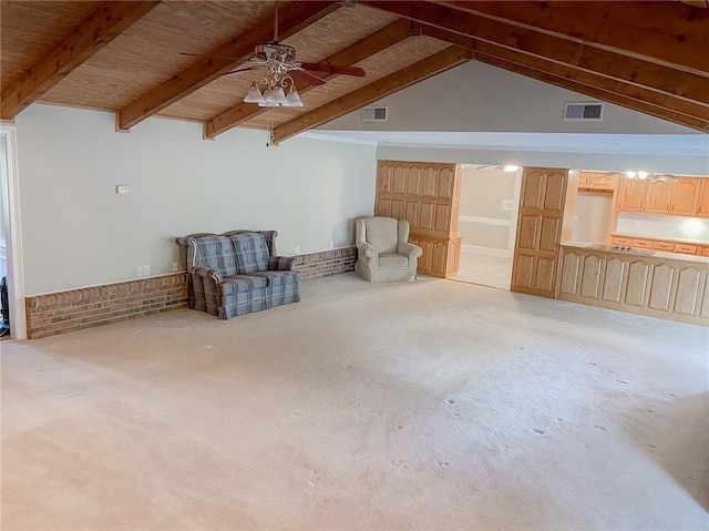 interior space featuring vaulted ceiling with beams, ceiling fan, wooden ceiling, and light carpet