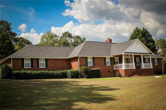 single story home featuring covered porch and a front yard