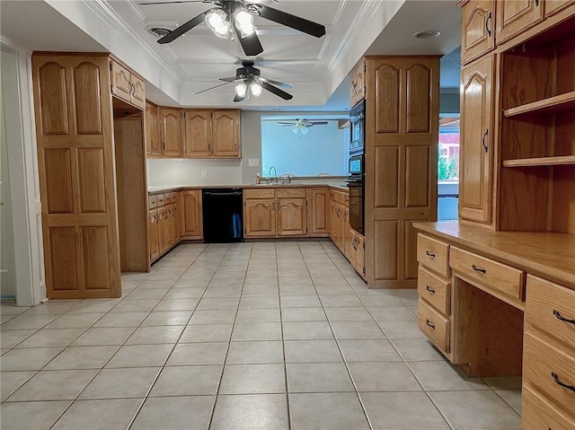 kitchen featuring black appliances, sink, crown molding, and a tray ceiling