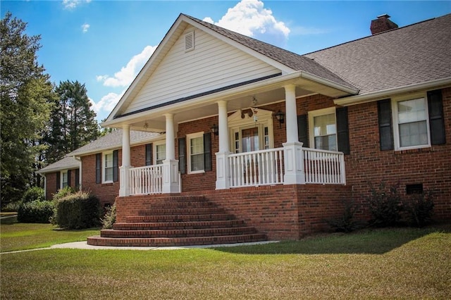 view of front of house featuring a porch and a front lawn