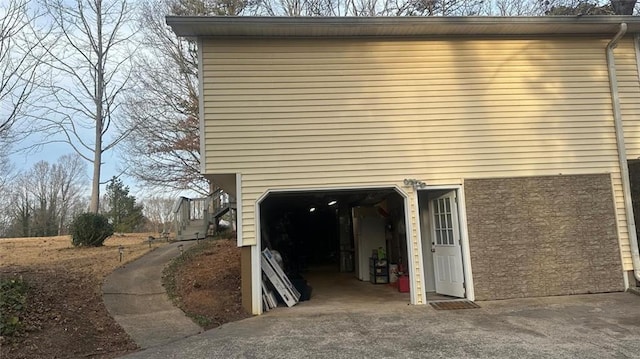 view of side of property featuring a garage