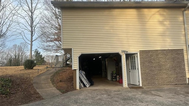 view of side of home with a garage