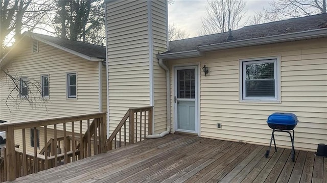 wooden terrace with area for grilling