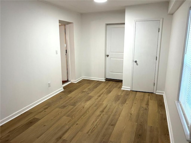 unfurnished bedroom featuring hardwood / wood-style flooring