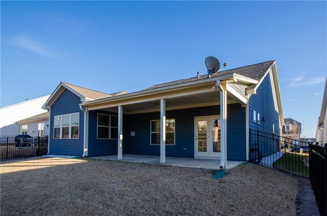 back of house with french doors and a patio