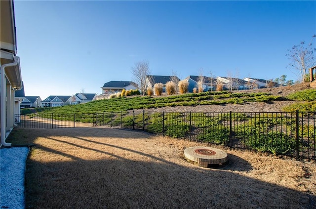 view of yard with a fire pit