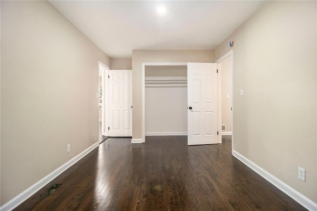 1207 Ellington Dr, Morrow, GA 30260 - unfurnished bedroom with dark wood finished floors, baseboards, a closet, and recessed lighting