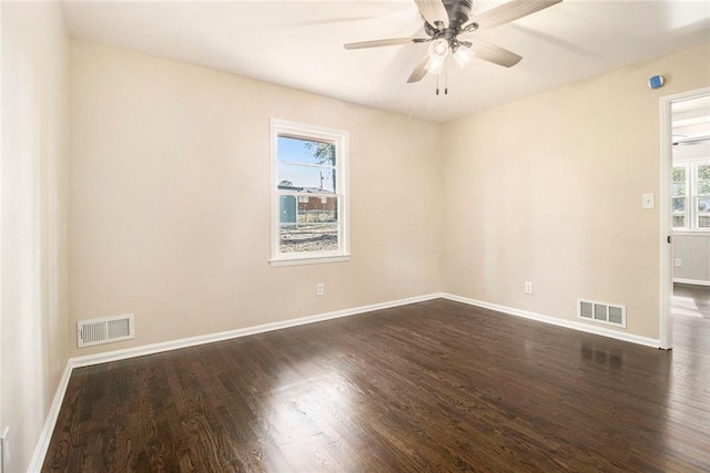 1207 Ellington Dr, Morrow, GA 30260 - empty room with dark wood-type flooring, baseboards, and a ceiling fan