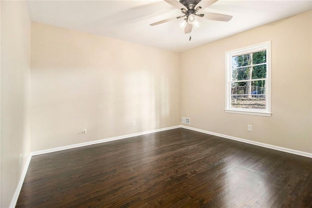 1207 Ellington Dr, Morrow, GA 30260 - empty room with dark wood-type flooring, baseboards, and ceiling fan