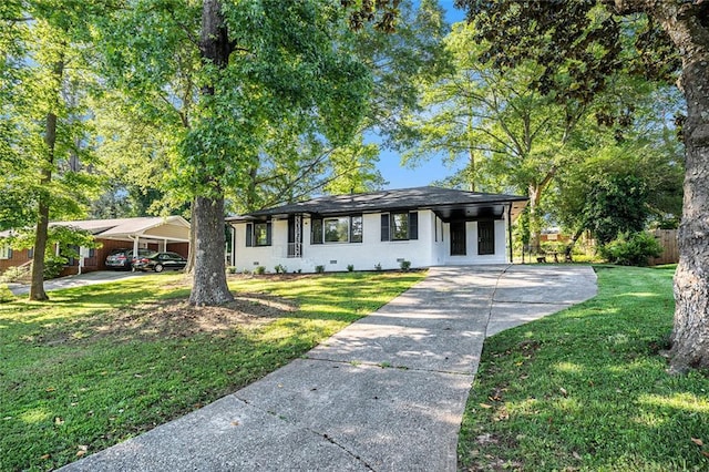 1207 Ellington Dr, Morrow, GA 30260 - view of front of property with concrete driveway, a front yard, and a carport