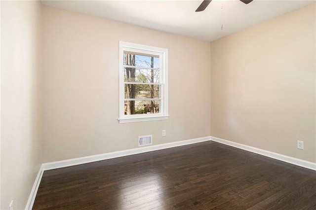 1207 Ellington Dr, Morrow, GA 30260 - unfurnished room with dark wood-style floors, ceiling fan, and baseboards