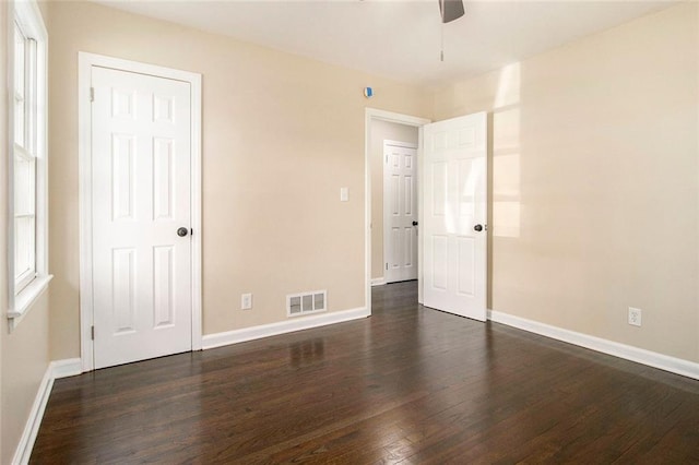 1207 Ellington Dr, Morrow, GA 30260 - unfurnished bedroom featuring dark wood-type flooring and baseboards