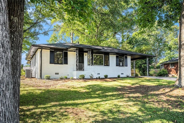 1207 Ellington Dr, Morrow, GA 30260 - view of front of property with crawl space, brick siding, a front yard, an attached carport, and central AC