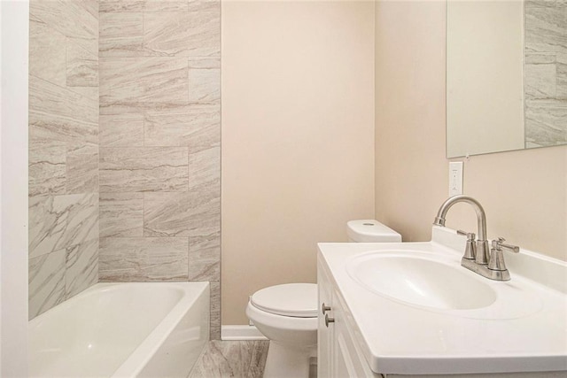 1207 Ellington Dr, Morrow, GA 30260 - bathroom featuring toilet, marble finish flooring, vanity, and baseboards