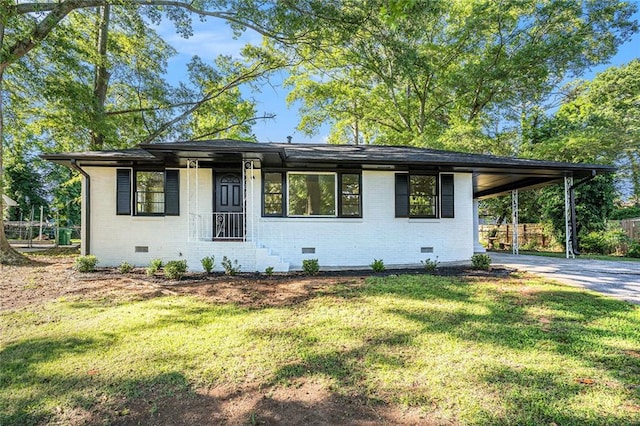 1207 Ellington Dr, Morrow, GA 30260 - view of front of home with crawl space, brick siding, driveway, and an attached carport