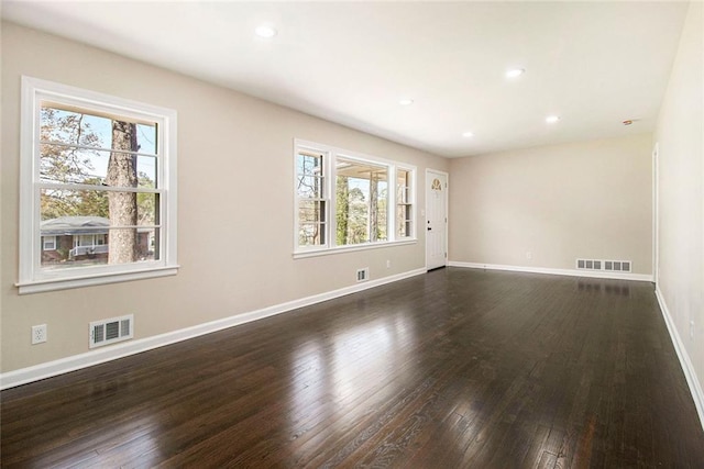1207 Ellington Dr, Morrow, GA 30260 - unfurnished room with healthy amount of natural light, dark wood-style floors, baseboards, and recessed lighting