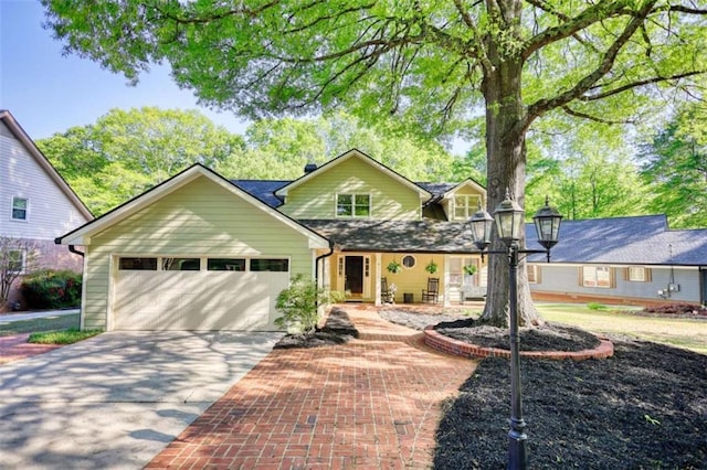 traditional-style house with driveway and an attached garage