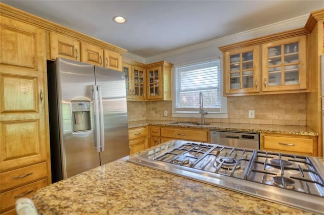 kitchen featuring stainless steel appliances, a sink, backsplash, glass insert cabinets, and recessed lighting