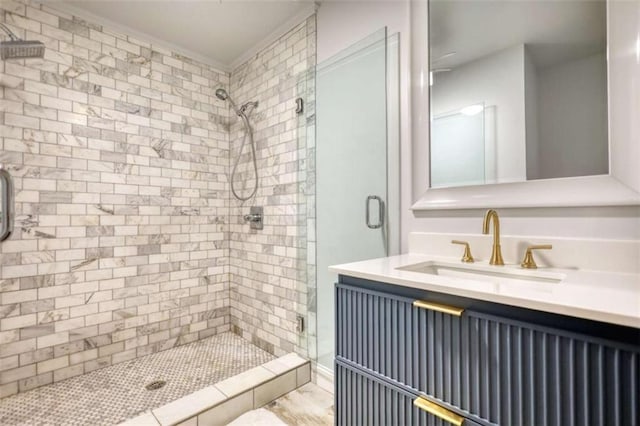full bathroom with a shower stall and vanity
