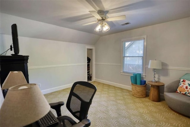 home office with light carpet, a ceiling fan, lofted ceiling, and baseboards