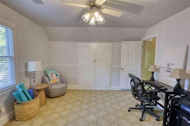 office area featuring lofted ceiling, carpet floors, ceiling fan, and baseboards