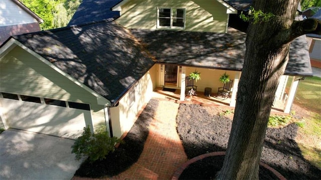 view of front facade with a shingled roof