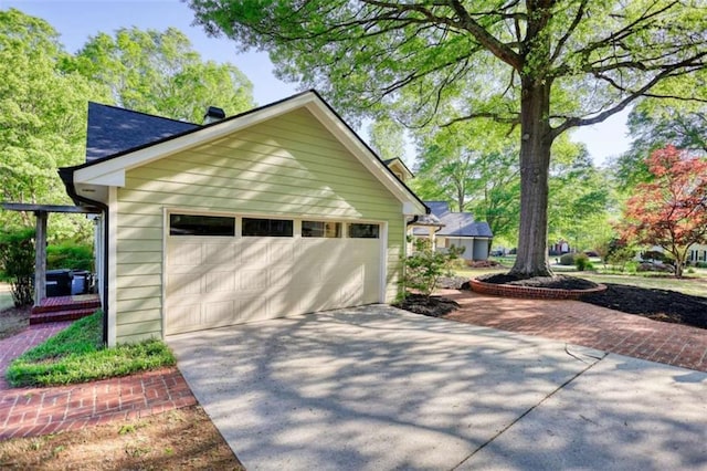 view of property exterior featuring a detached garage