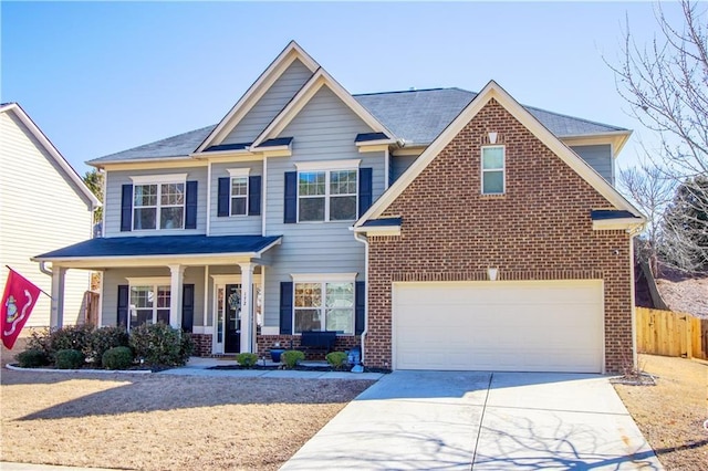 view of front facade featuring a garage and covered porch