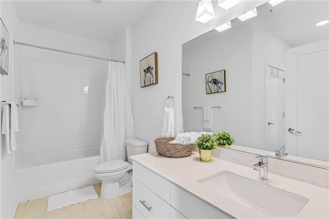 full bathroom with shower / bath combo, vanity, and toilet