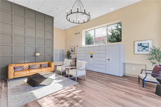 interior space featuring a chandelier and light hardwood / wood-style floors