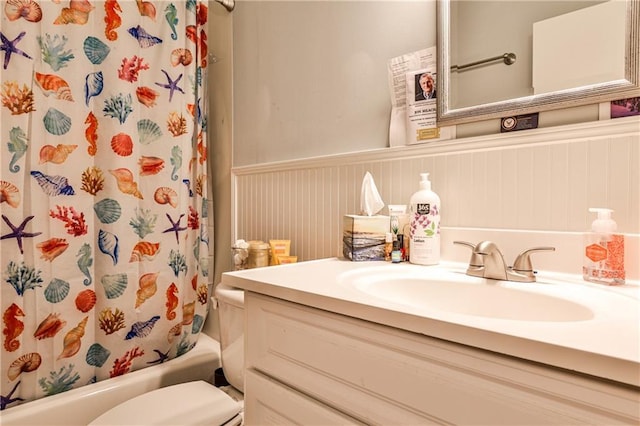 1111 Clairemont Ave Unit N5, Decatur, GA 30030 - bathroom with toilet, wainscoting, shower / tub combo with curtain, and vanity