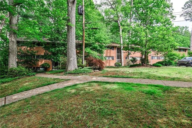 1111 Clairemont Ave Unit N5, Decatur, GA 30030 - view of front of house featuring brick siding and a front yard