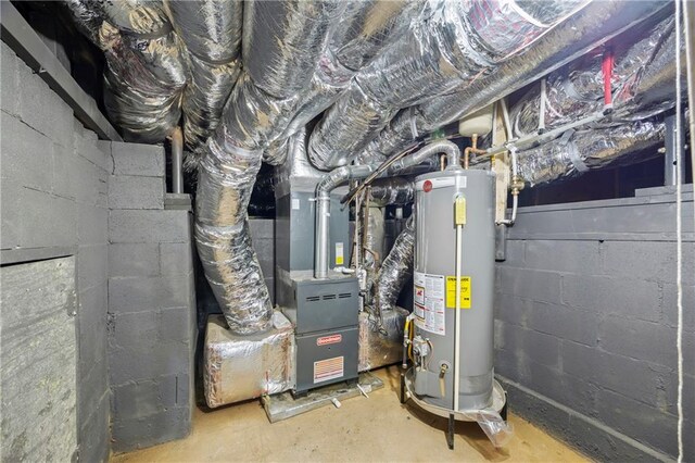 utility room featuring gas water heater