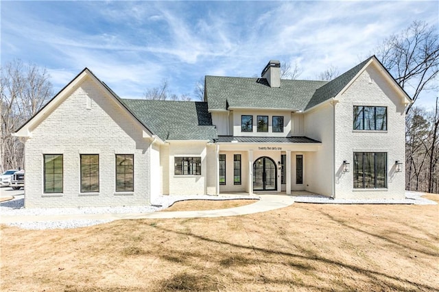 789 Old Mill Ct, Ball Ground, GA 30107 - back of house featuring brick siding, a chimney, and a standing seam roof