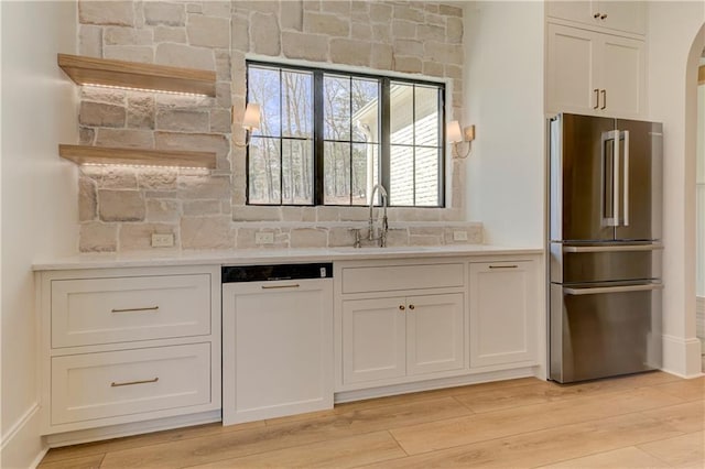 789 Old Mill Ct, Ball Ground, GA 30107 - kitchen featuring high quality fridge, dishwasher, a sink, and white cabinetry