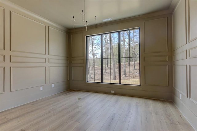 789 Old Mill Ct, Ball Ground, GA 30107 - spare room with a decorative wall and light wood-type flooring