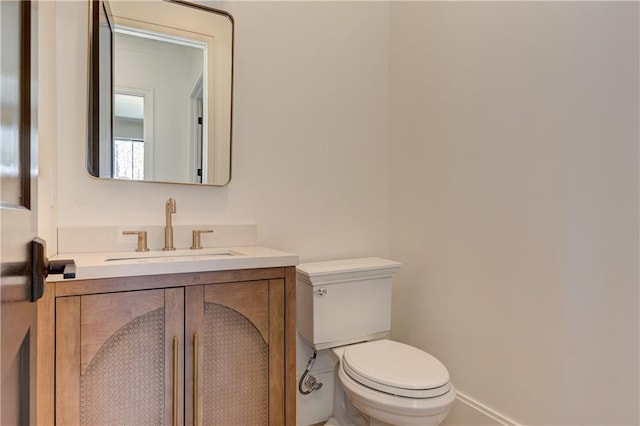 789 Old Mill Ct, Ball Ground, GA 30107 - bathroom featuring toilet, vanity, and baseboards