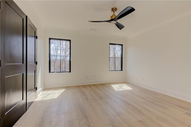 789 Old Mill Ct, Ball Ground, GA 30107 - unfurnished bedroom featuring multiple windows, light wood finished floors, and baseboards