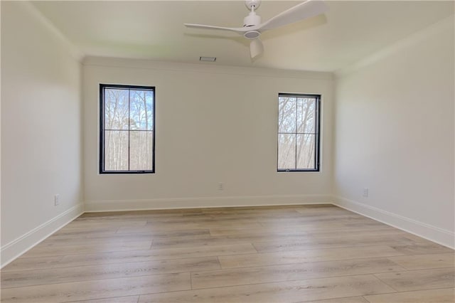 789 Old Mill Ct, Ball Ground, GA 30107 - unfurnished room featuring healthy amount of natural light, light wood finished floors, crown molding, ceiling fan, and baseboards